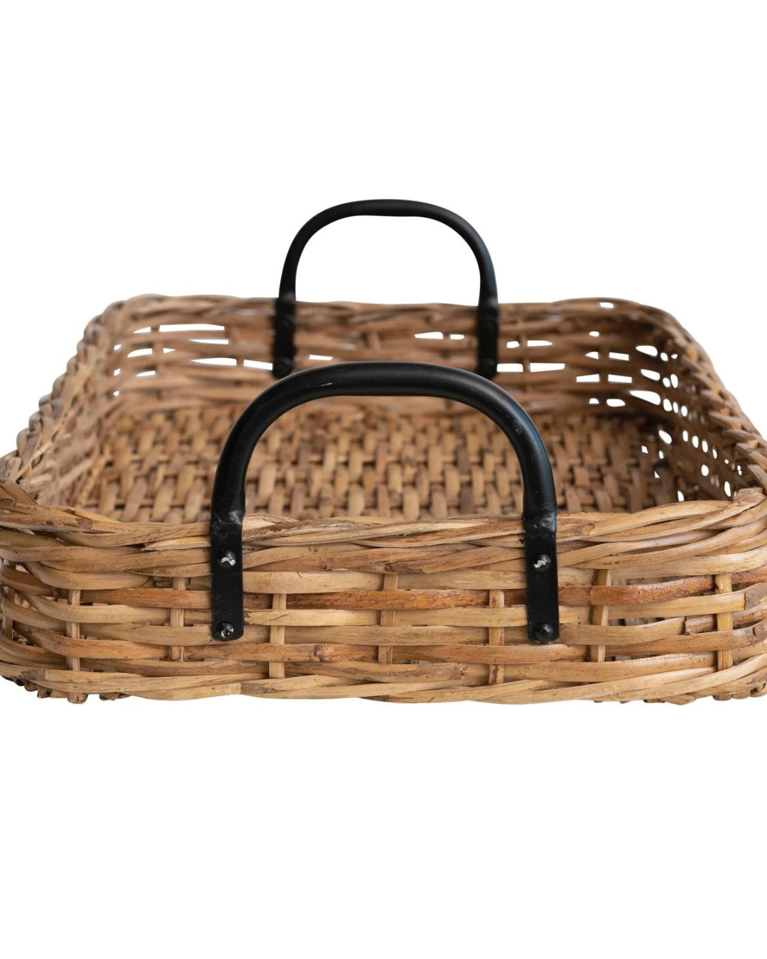 The Creative Co-op Rattan Tray is a rectangular wicker basket featuring a woven pattern and two sturdy black metal handles. This hand-woven tray boasts a natural, rustic look with its light brown color, making it perfect for storage or as farmhouse decor. Add charm to any space with this beautifully crafted piece.