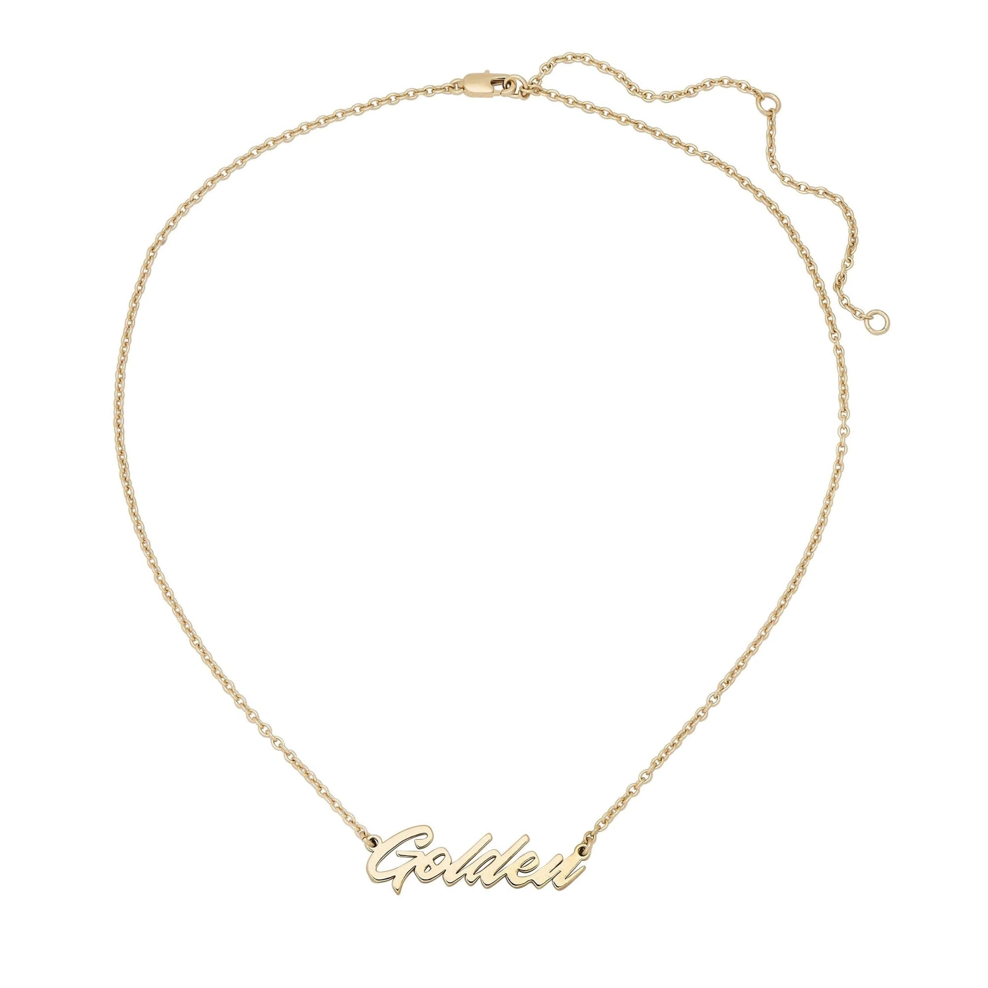 The Faire Script Necklace is a gold chain with a "Golden" cursive pendant, handmade in the USA. It features an adjustable clasp for a perfect fit.