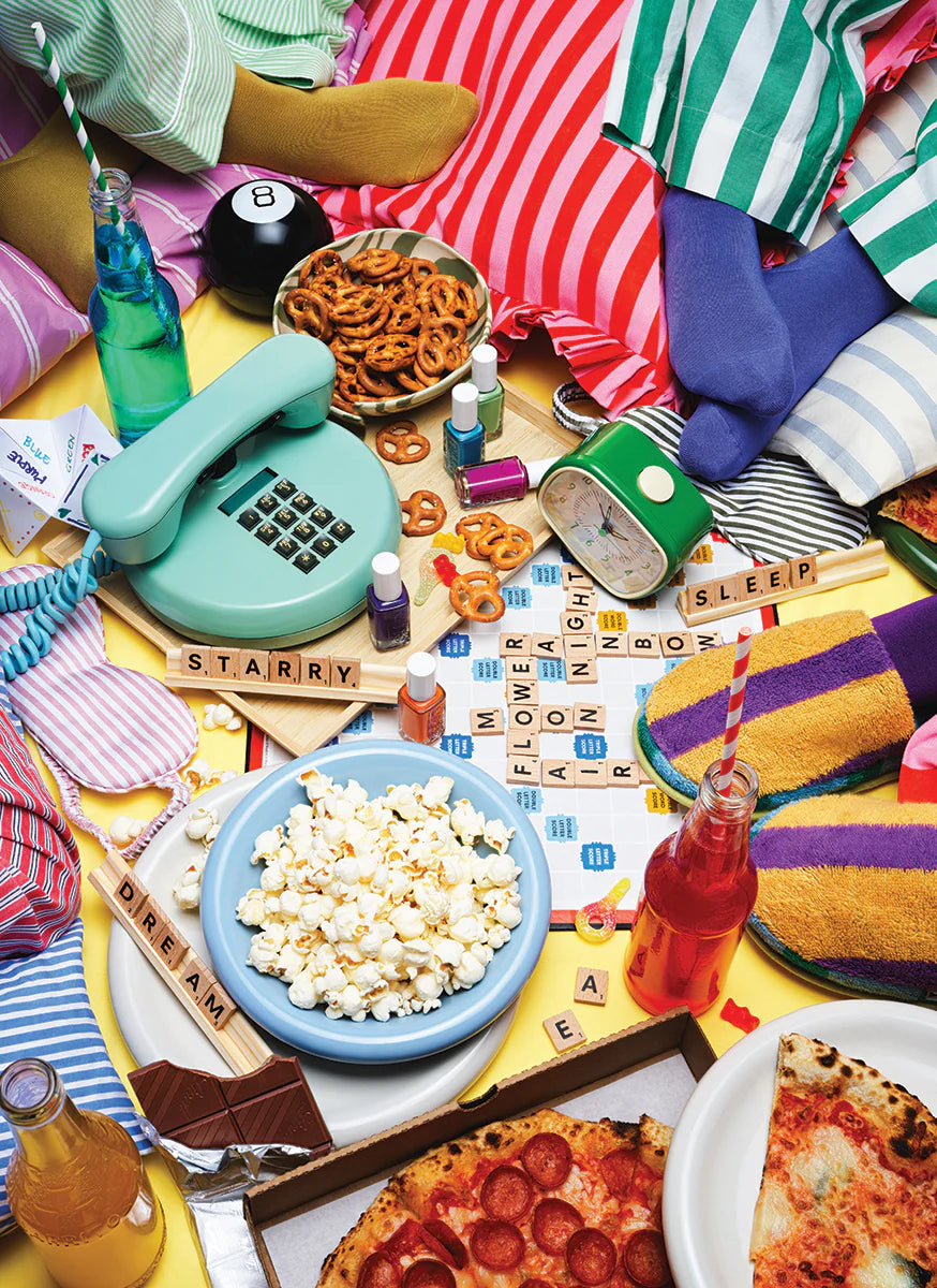 The Faire Pajama Party Puzzle features a lively scene with snacks, a vintage phone, board game, alarm clock, nail polish, and playful items—perfect for a 1000-piece recycled paper jigsaw.