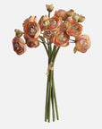 The 10'' Silk Baby Ranunculus Flower Bunch by Faire features pink and orange silk blooms, green leaves, and long stems tied with twine—perfect as multifunctional decor against a plain white background.
