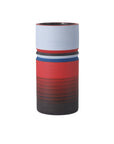 The Currey & Company, Inc. Black/Blue/Red 80's Medium cylindrical ceramic vase features horizontal stripes in blue, white, red, and brown, adding colorful decor to your space and shown against a plain white background.