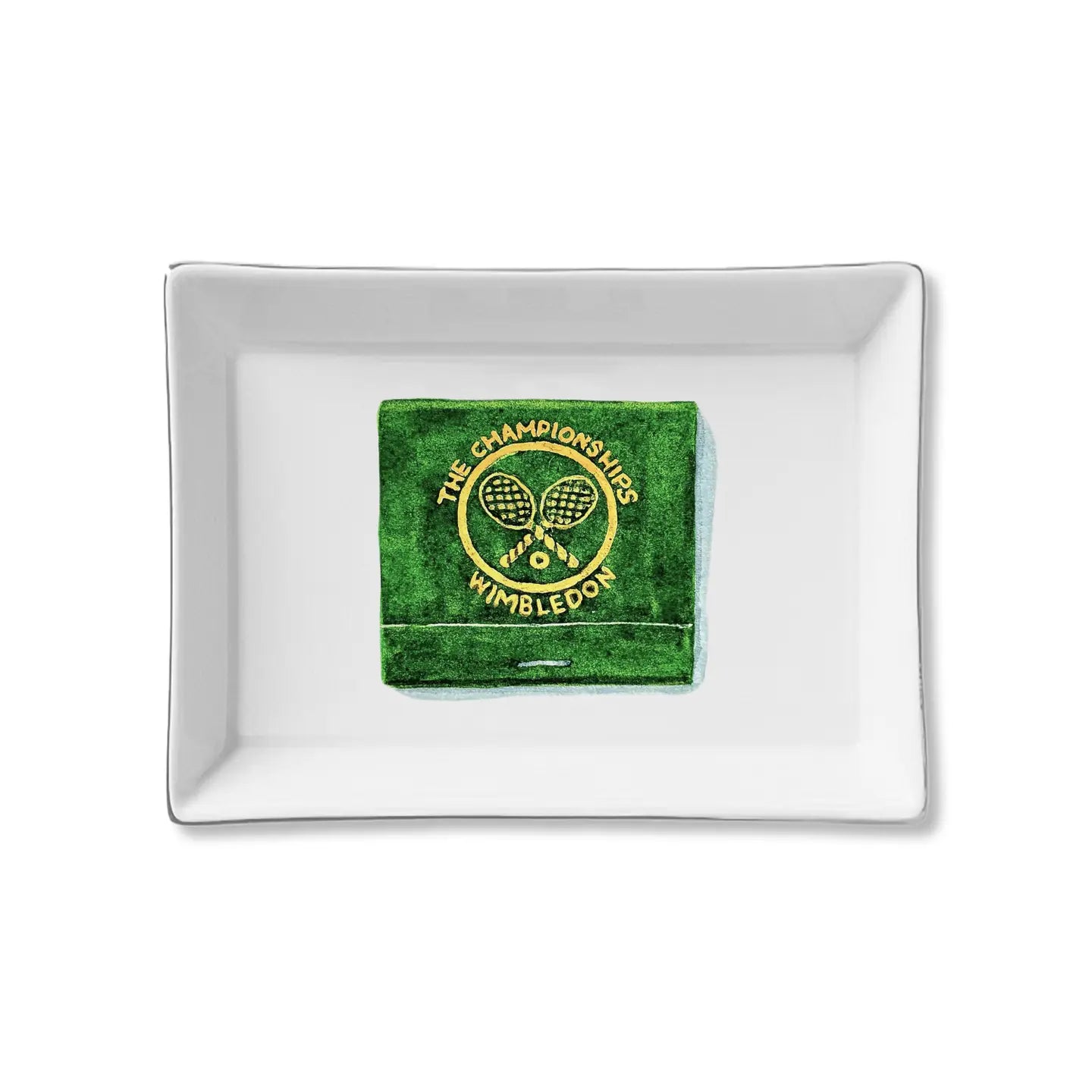 The Faire Ceramic Tray is a rectangular white ceramic trinket holder with a green box, crossed tennis rackets, and "The Championships Wimbledon" logo—ideal for organizing essentials or gifting.