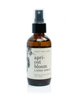 The "Linen Spray" by Faire has an amber hue and a black cap. It's a 4 oz / 125 ml bottle with apricot, pear, and jasmine notes and is made in the USA. It offers a fresh scent reminiscent of bergamot's zest.