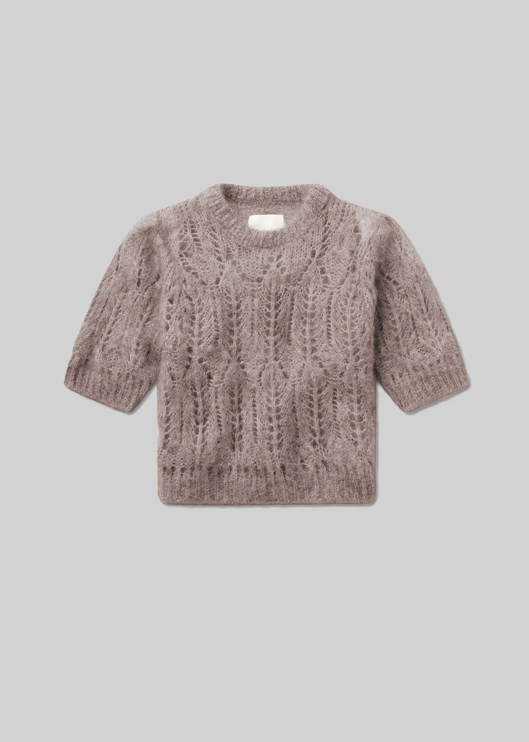 The Odette Puff Sleeve Sweater by Citizens Of Humanity/AGOLDE features a light brown wool-blend, cable pattern, short puff sleeves, and a round neckline for a feminine knit look, shown on a plain gray background.