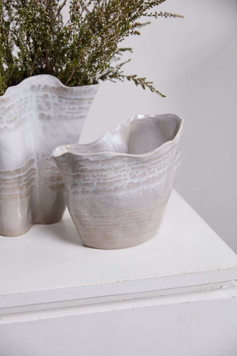Pair of Claribel Vase Short by Accent Decor on white surface, one holding green foliage, modern decorative style.