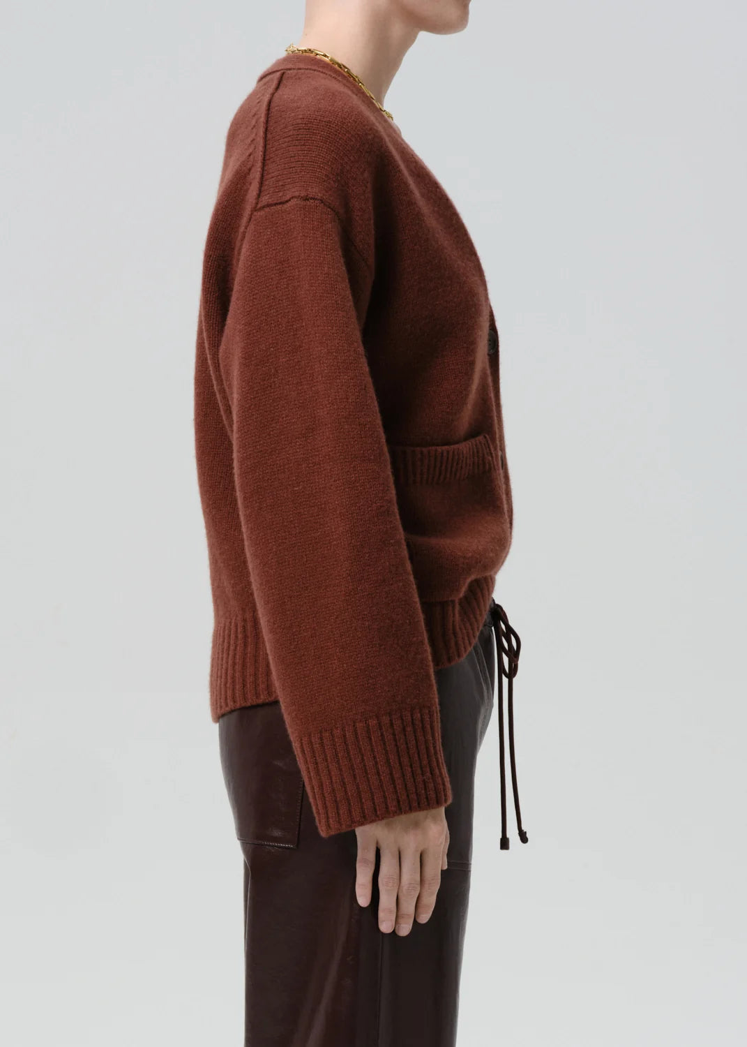 Essential Slouchy Cardigan Sweater by Citizens of Humanity/AGOLDE shown on model in profile, relaxed fit.