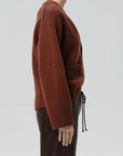 Essential Slouchy Cardigan Sweater by Citizens of Humanity/AGOLDE shown on model in profile, relaxed fit.