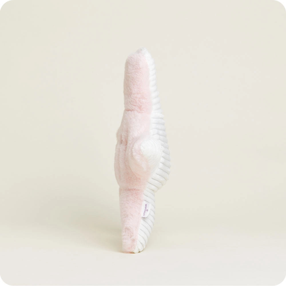The Faire Starfish Warmies slipper in pastel pink and white stands upright on a light background, highlighting its plush, fuzzy texture and ribbed white sole—crafted for sensory comfort and soothing relaxation.