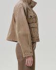 Tan funnel collar barn jacket by Citizens Of Humanity/AGOLDE shown in profile against a light background.