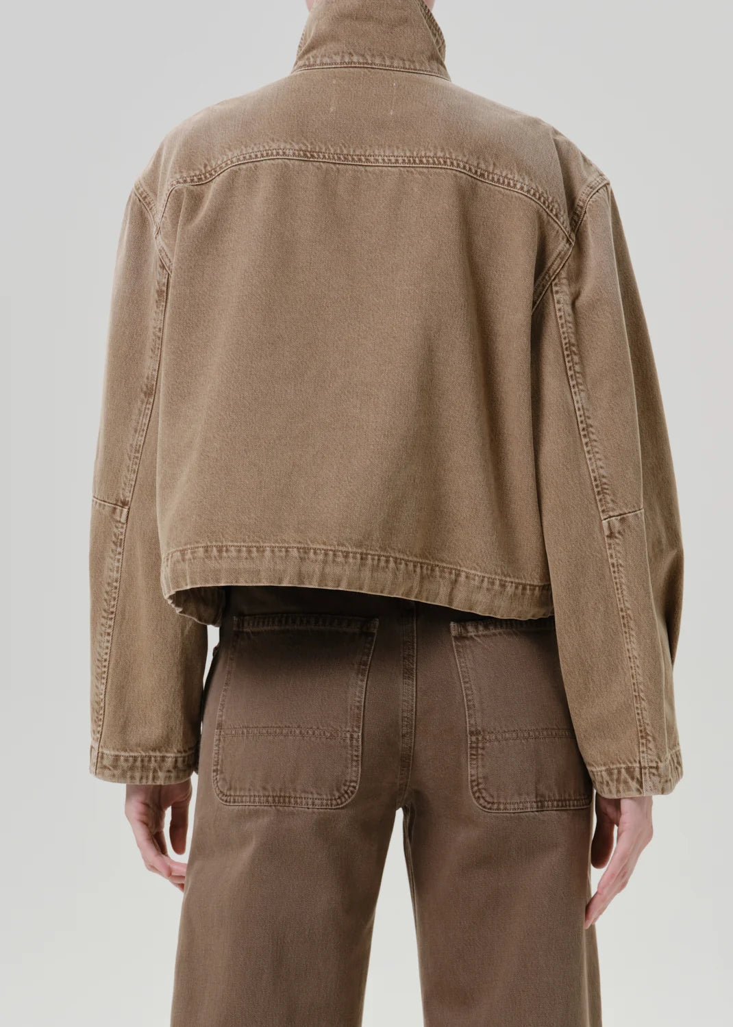 Tan Citizens Of Humanity funnel collar barn jacket and matching brown pants, back view.