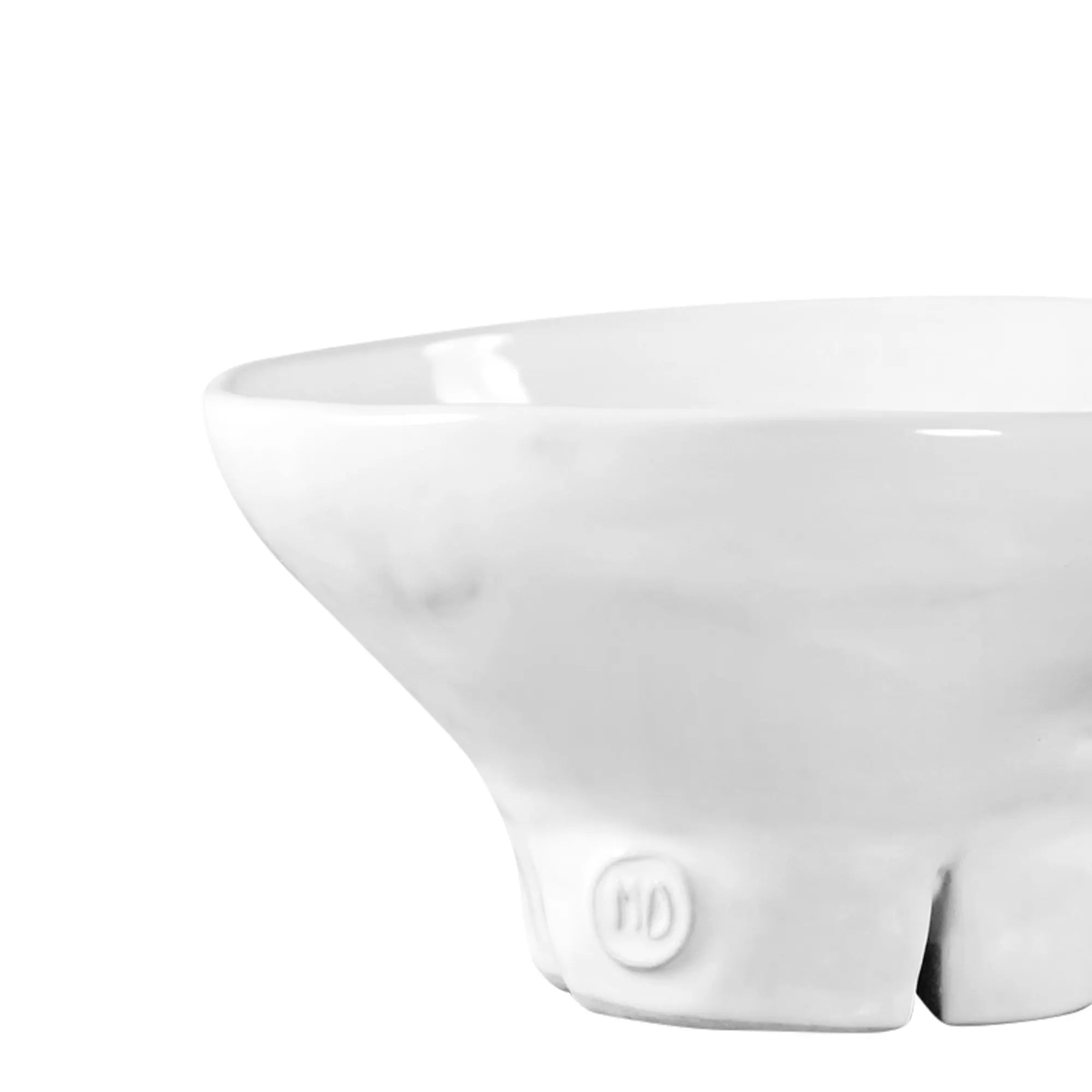 The Montes Doggett Catchall Bowl No 257 is a high-fired white ceramic bowl with a wide rim, narrow base, and small "MO" emblem. Microwave and dishwasher safe, it's photographed on a plain white background.