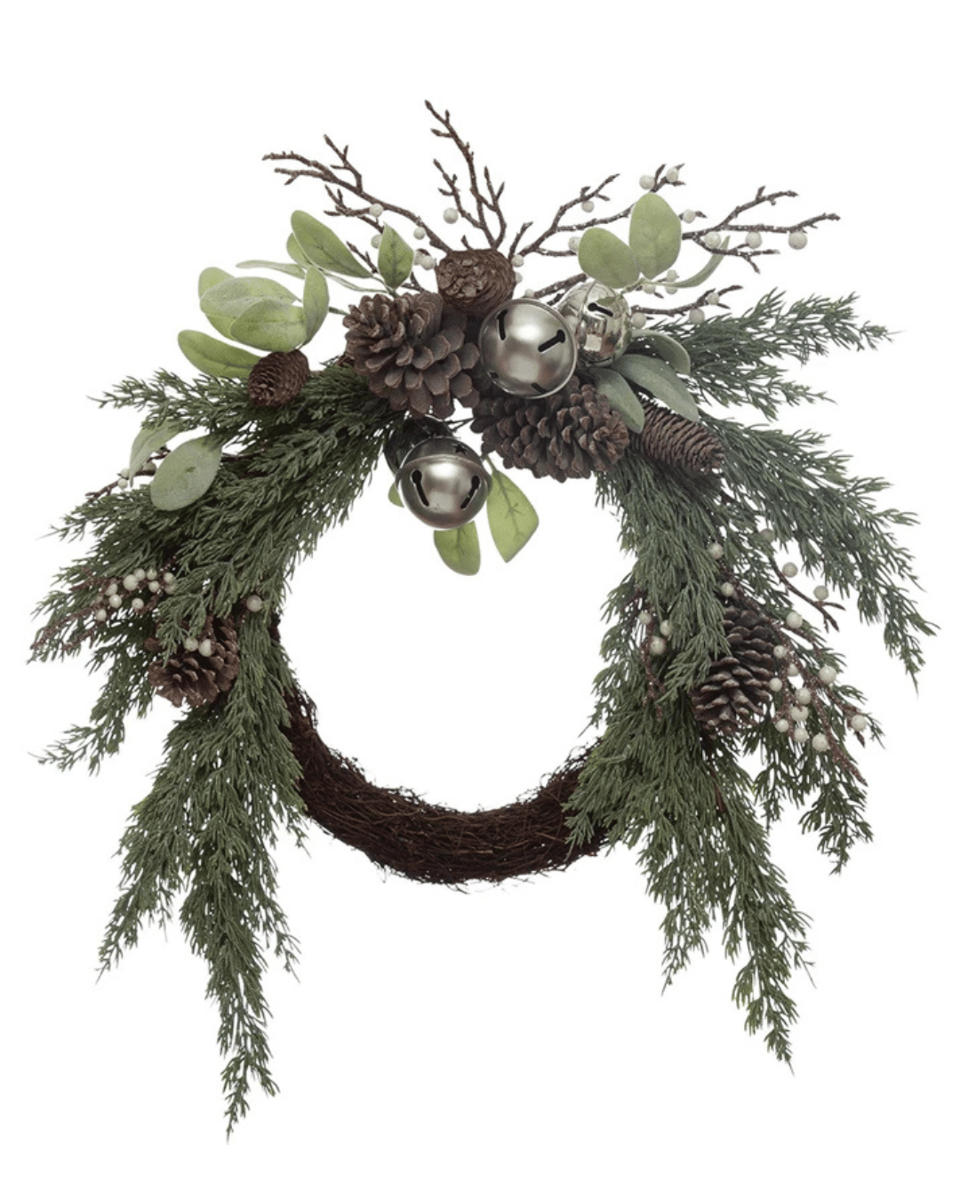 The Juniper & Greens Wreath by Creative Co-op features rustic foliage, silver bells, pinecones, green leaves, and bare twigs in a natural arrangement that exudes whimsical holiday charm against a crisp white background.