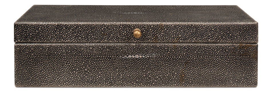 The Gatsburg Shagreen Box by Sarreid is a rectangular black storage box featuring a dotted pebble-textured surface and a small round brass knob at the front center, shown against a white background.