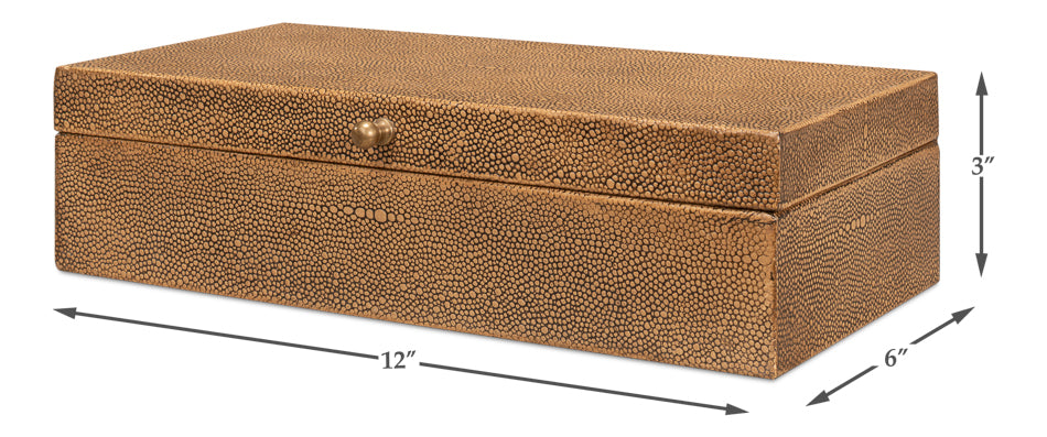The Sarreid Gatsburg Shagreen Box features a tawny brown finish, rectangular shape, and small round front knob. Measuring 12"L x 6"D x 3"H, it adds transitional elegance and functional storage to any room.