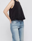 Moussy MV Sculpted Satin Top with scoop neckline styled with light blue jeans, hand in pocket.