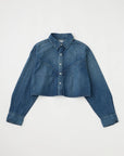 The Foley Shirt by Moussy is a women's cropped denim button-down with long sleeves, pointed collar, and visible seams, shown laid flat on a white background.