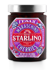 A jar of Italian Maraschino Cherries from Faire showcases a vibrant pink and purple label. These luxury cherries, soaked in natural Marasca juice, are ideal for elevating cocktails. This Italian delicacy has a net weight of 14.1 oz (400g).