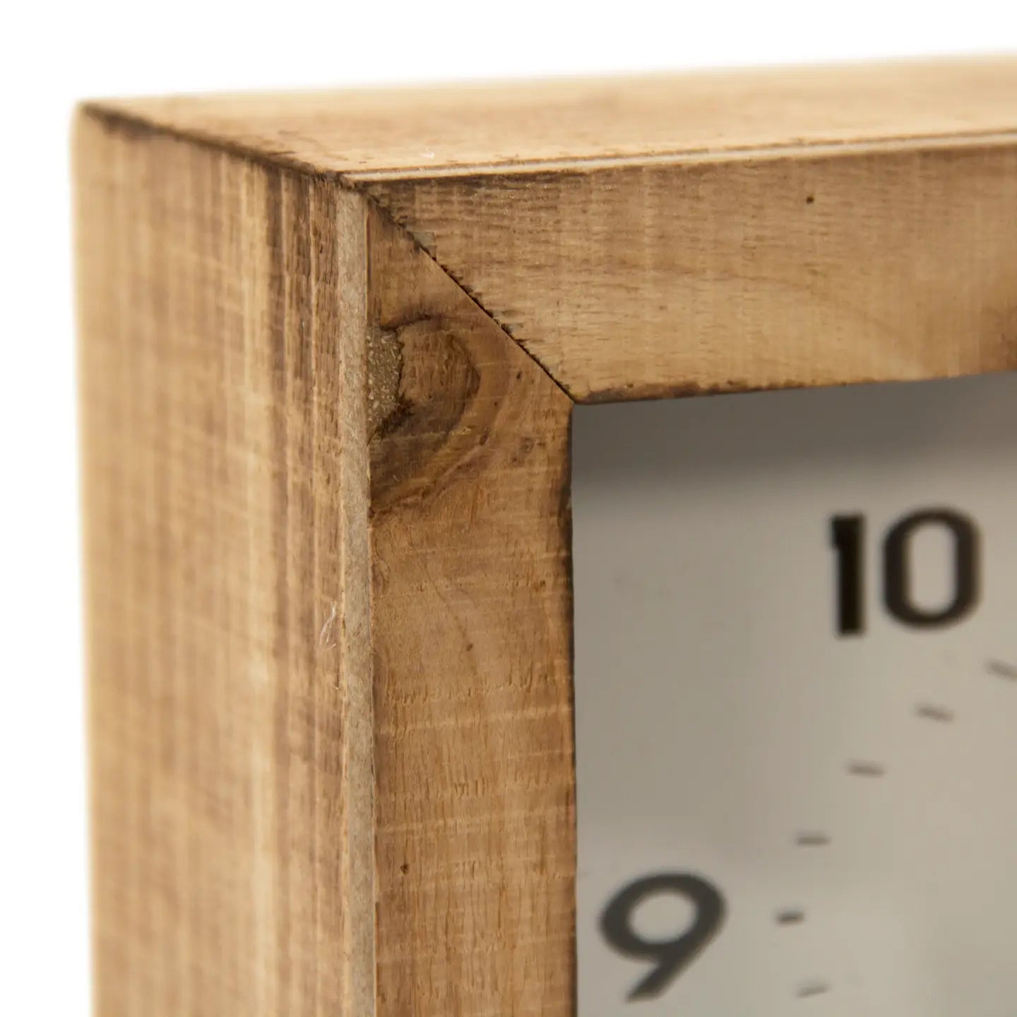 Close-up of the Zentique Wooden Clock featuring a natural, unfinished frame with a highlighted corner joint. Visible are black numbers 9 and 10 on the white face, accented by subtle silver knob legs underneath.
