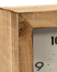 Close-up of the Zentique Wooden Clock featuring a natural, unfinished frame with a highlighted corner joint. Visible are black numbers 9 and 10 on the white face, accented by subtle silver knob legs underneath.