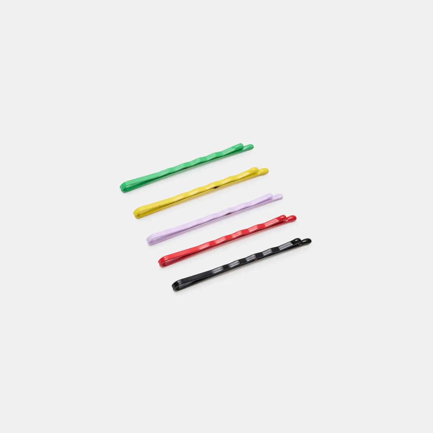 Five CHUNKS Bobby Pins by Faire in green, yellow, red, purple, and black are arranged diagonally on a white background.