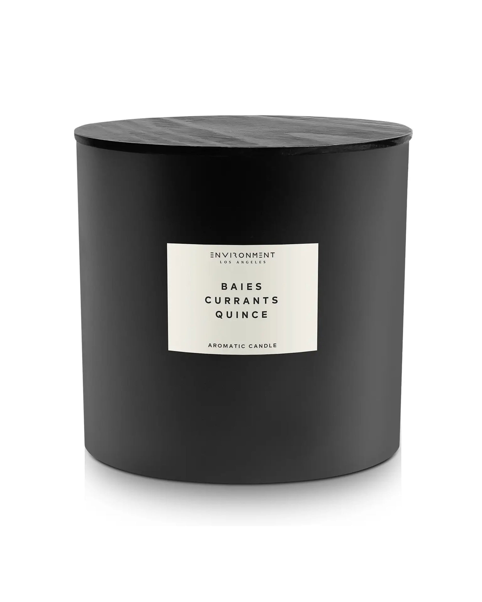 A 55 OZ black cylindrical coconut wax candle by Faire, featuring a wooden lid and a label reading "ENVIRONMINT ALCHEMY, BAIES CURRANTS QUINCE, AROMATIC CANDLE" in black text—a diptyque-inspired accent for refined spaces.