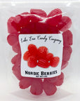 The Lake Erie Valentine Candy by Faire comes in a clear bag with red and blackberry-shaped gummies. Festive and perfect for Valentine's Day, this 4 oz. treat features a colorful "Nordic Berries" label with images of the candies.