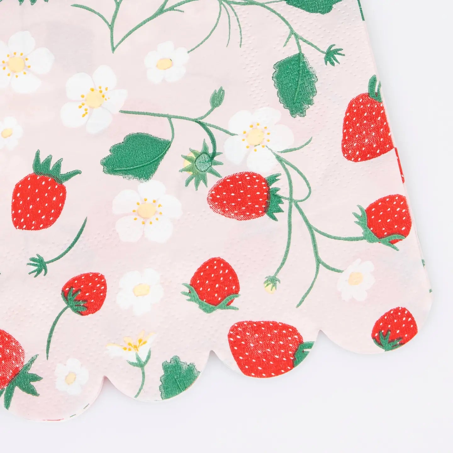 Faire's Strawberry Guest Towels feature a pink scalloped edge and are decorated with red strawberries, green leaves, and white flowers—an ideal addition to your garden party decor.