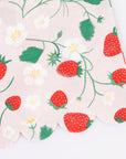 Faire's Strawberry Guest Towels feature a pink scalloped edge and are decorated with red strawberries, green leaves, and white flowers—an ideal addition to your garden party decor.