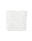 A solitary MME Napkin by Faire, displaying small embossed dots, is centered on a plain white background.