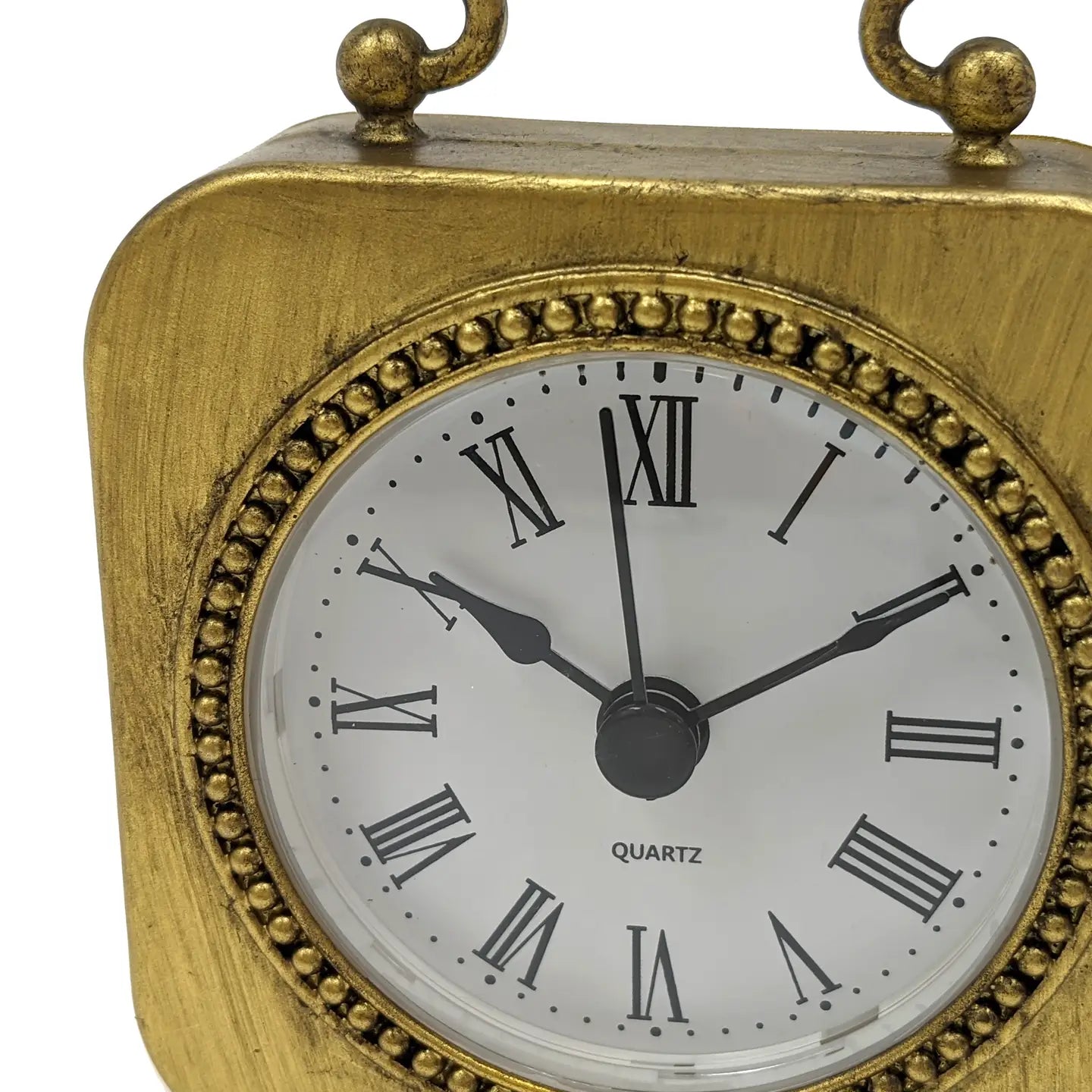 The Zentique Gold Table Clock Pewter showcases a vintage style with Roman numerals, black hands on a white face, and decorative beading around the dial—making it a chic accent piece for modern decor. Displays 10:00:59.