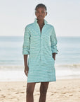 On a sandy beach in Southern Ireland, a woman wears the Frank & Eileen Southern Dress as the ocean and sky provide a scenic backdrop.
