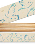 The Faire Long Safety Matches come in a rectangular box featuring blue dove line art and “PEACE.” Inside, neat rows of long wooden matches with white tips make this a unique choice for match box collectors.