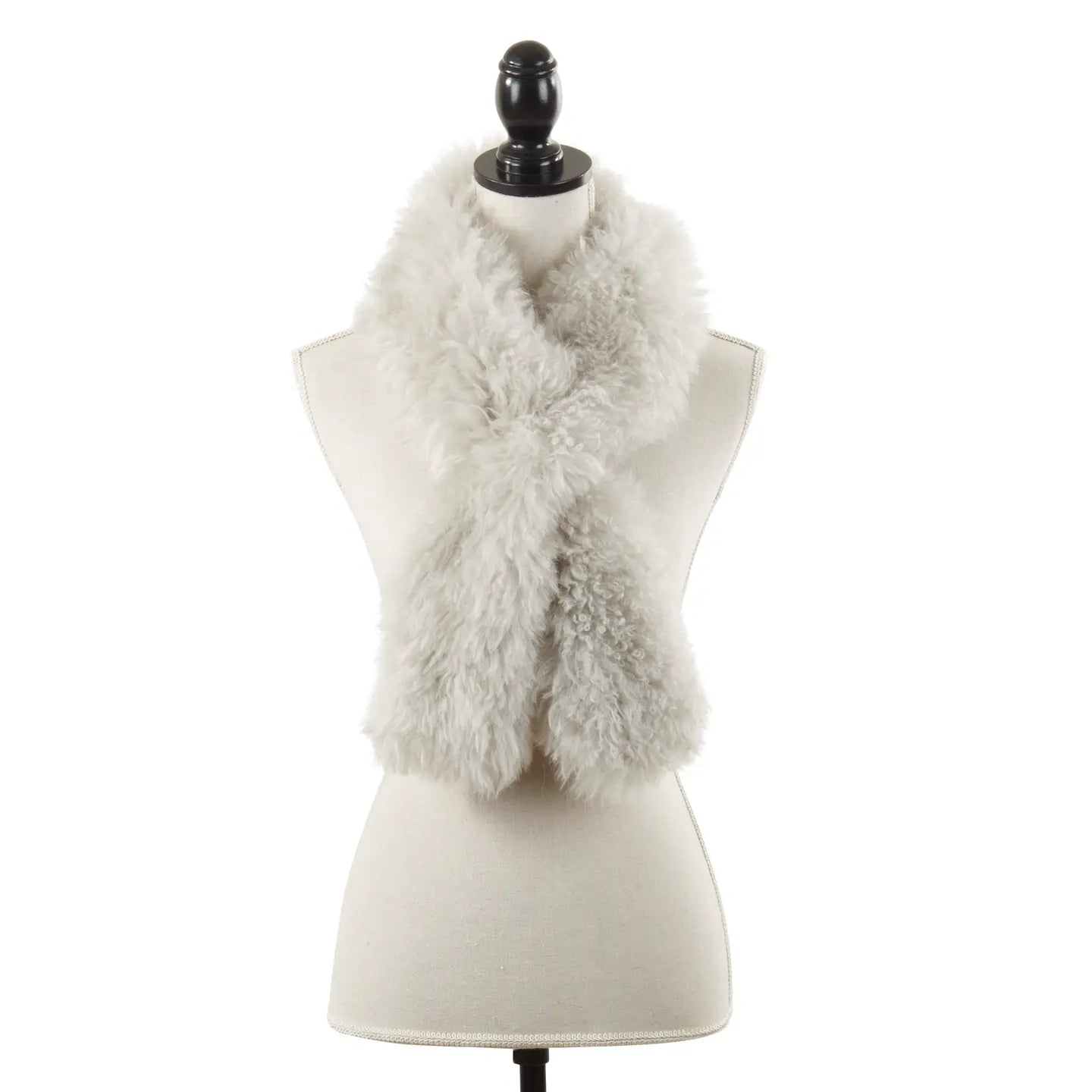 The Faire Lamb Fur Pull Through exudes luxurious warmth as it drapes around the neck of a cream dress form mannequin on a black stand, shown against a plain white background.