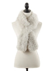 The Faire Lamb Fur Pull Through exudes luxurious warmth as it drapes around the neck of a cream dress form mannequin on a black stand, shown against a plain white background.