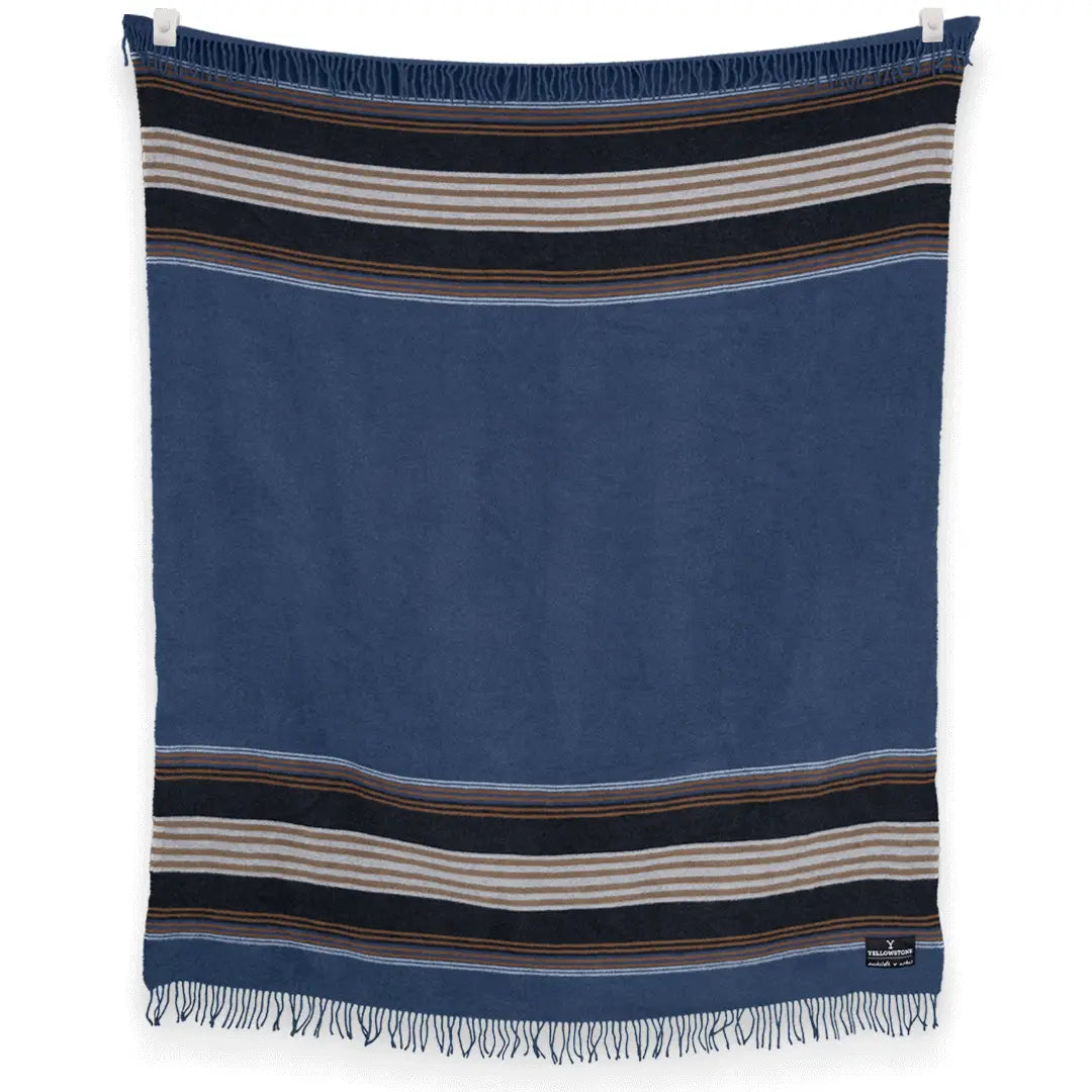 The S&A Blanket by Faire is a rectangular, vintage-inspired blue throw featuring black, white, and brown horizontal stripes near the top and bottom, finished with short fringe along the edges and shown against a white background.