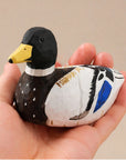 Faire black hand-painted carved basswood duck figurine held in hand, rustic accent from Bungalow Furniture & Accessories.