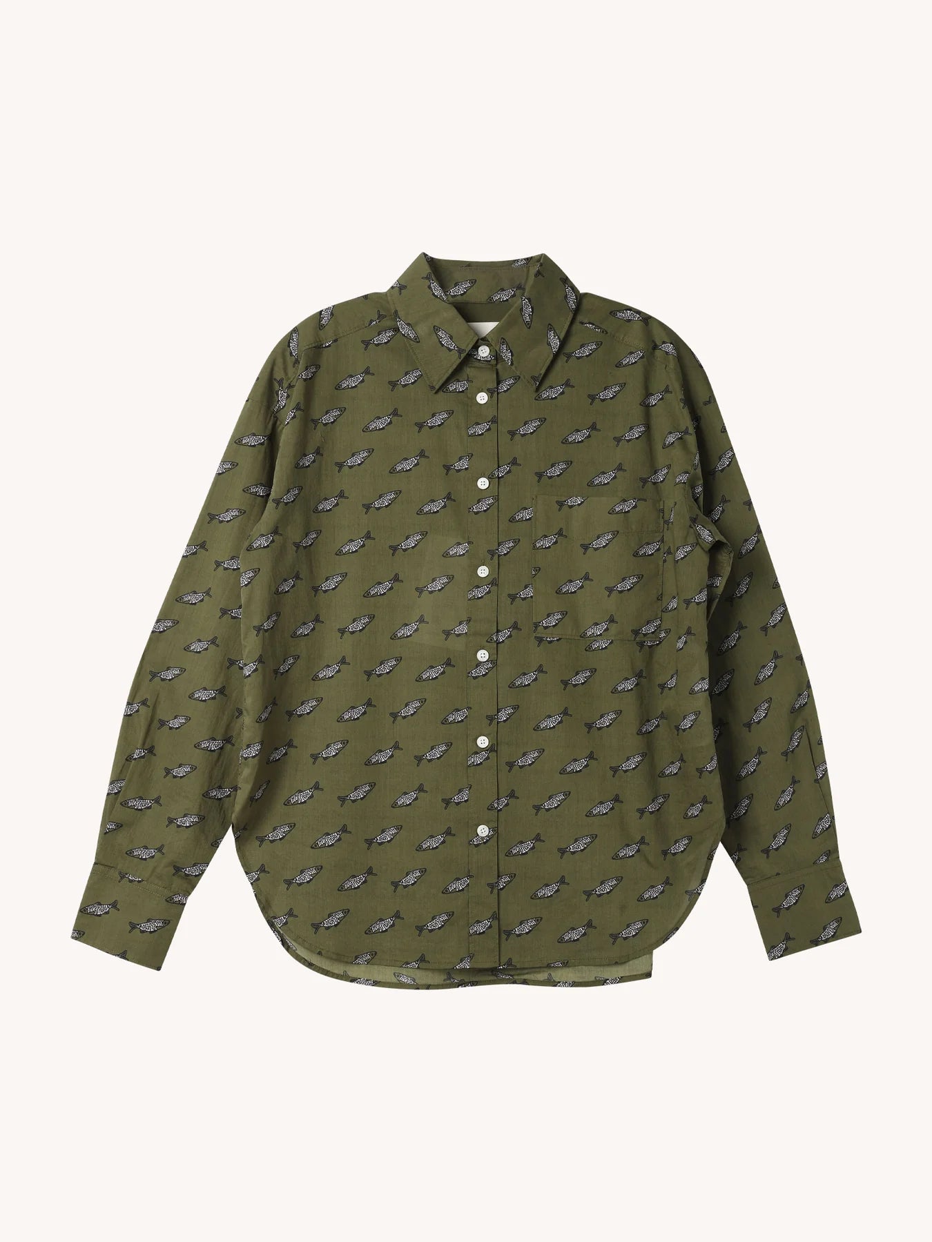 The CLOSED Oversized Shirt is olive green with long sleeves, a collar, white buttons, and a curved hem. It features a small black and white car pattern throughout and playful embroidered patches, inspired by classic denim shirt styles.