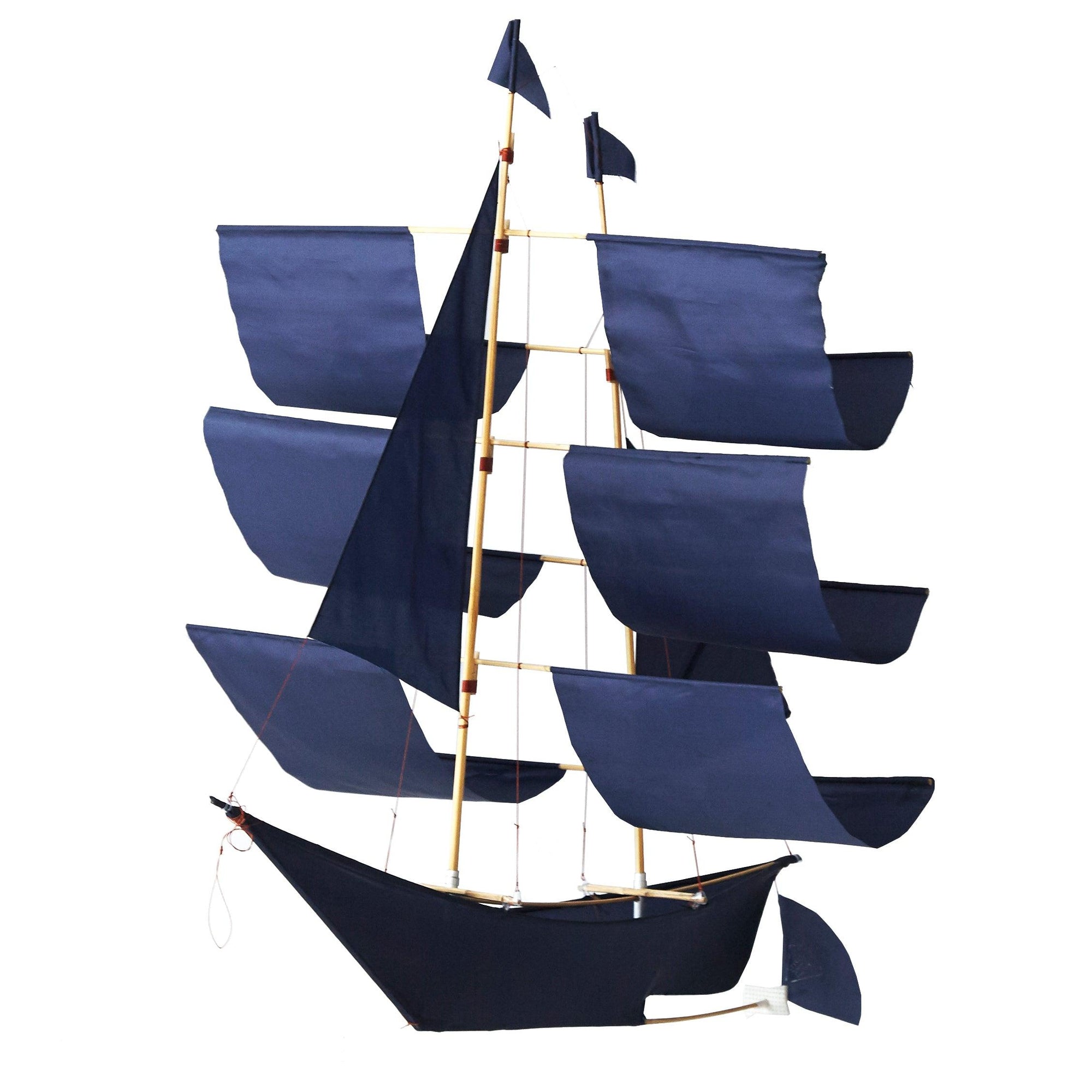 A model sailboat with a black hull and three masts, each with dark blue sails and small flags, resembles the Faire Sailing Ship Kite, set against a plain white background.