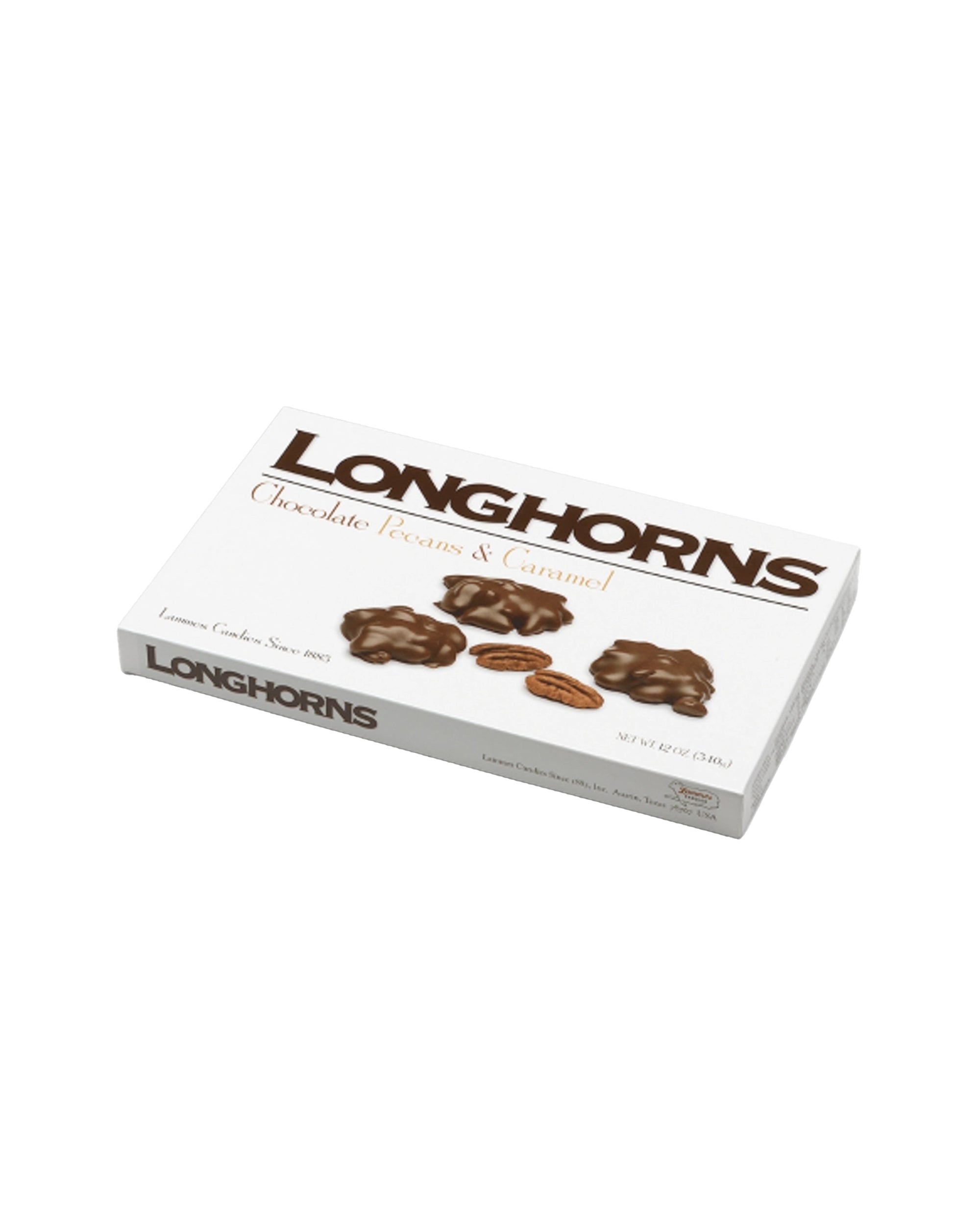 A white box of Faire LC Longhorns Milk Chocolate 6oz features images of chocolate-covered pecans, a caramel piece, and a pecan, with text highlighting the delicious milk chocolate caramel contents on the front.