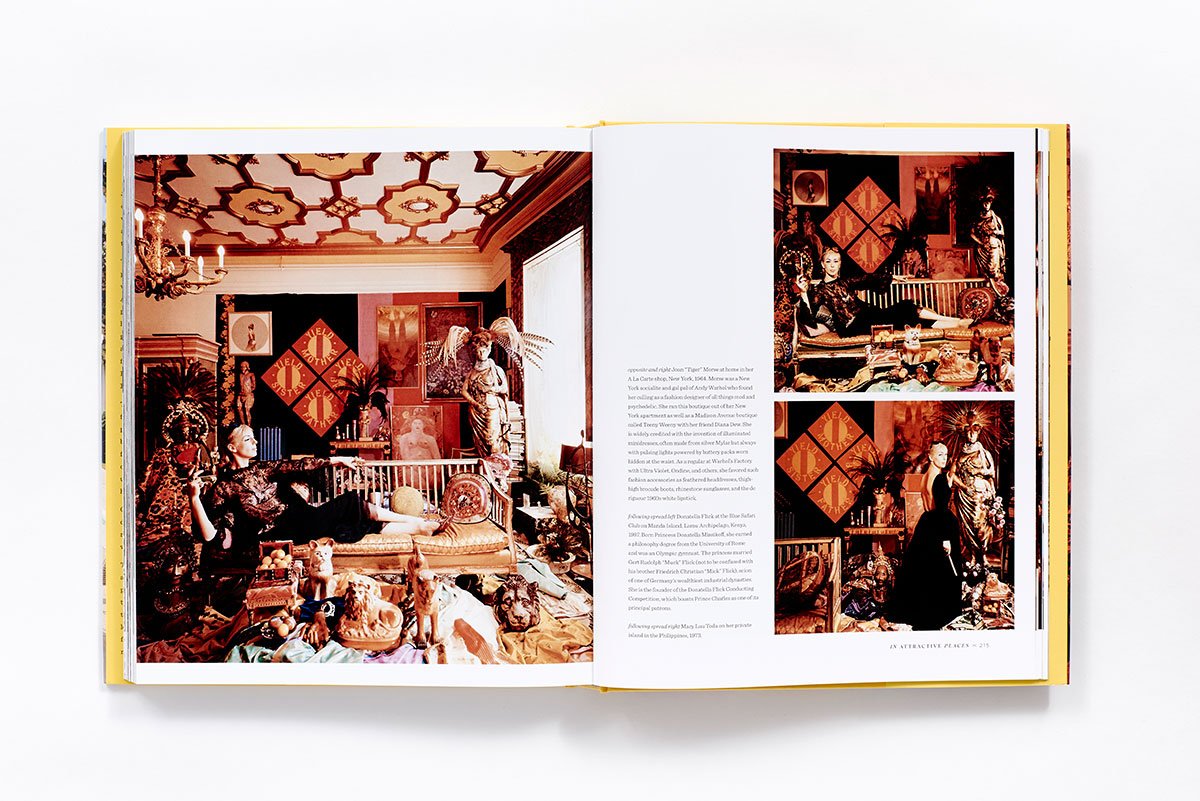 Slim Aarons: Women by Hachette Book Group is pictured open, revealing vibrant photos of ornately decorated rooms filled with art—evoking classic Hollywood style. One large image appears on the left, while three smaller images and text are on the right page.