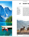 A vivid image from "150 National Parks You Need" by Simon & Schuster Inc. shows turquoise Moraine Lake, red canoes at a wooden dock, pine trees, snowy peaks, and two elk in a grassy field with mountains behind.