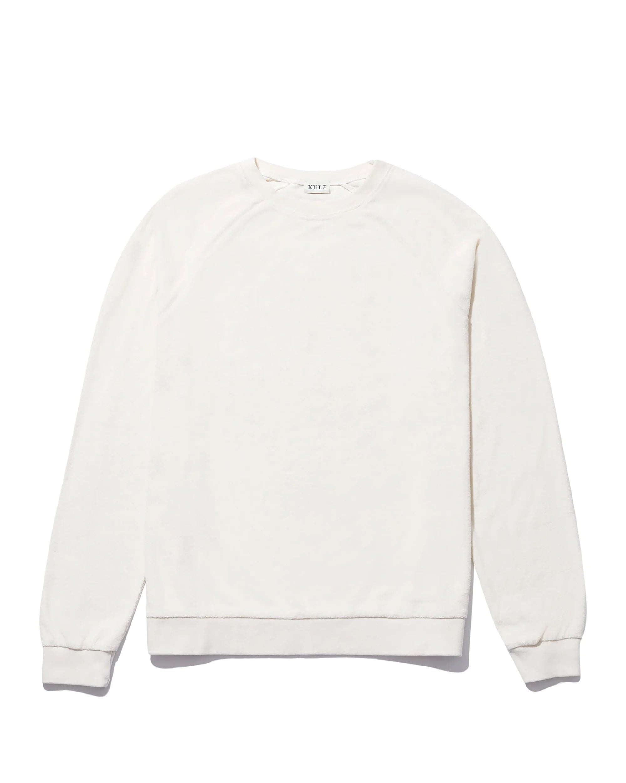 The Kule "The Terry Franny" sweatshirt is a plain, long-sleeve, crew neck cotton-blend top in solid off-white, shown laid flat on a white background. Its design is simple and free from patterns, logos, or embellishments.