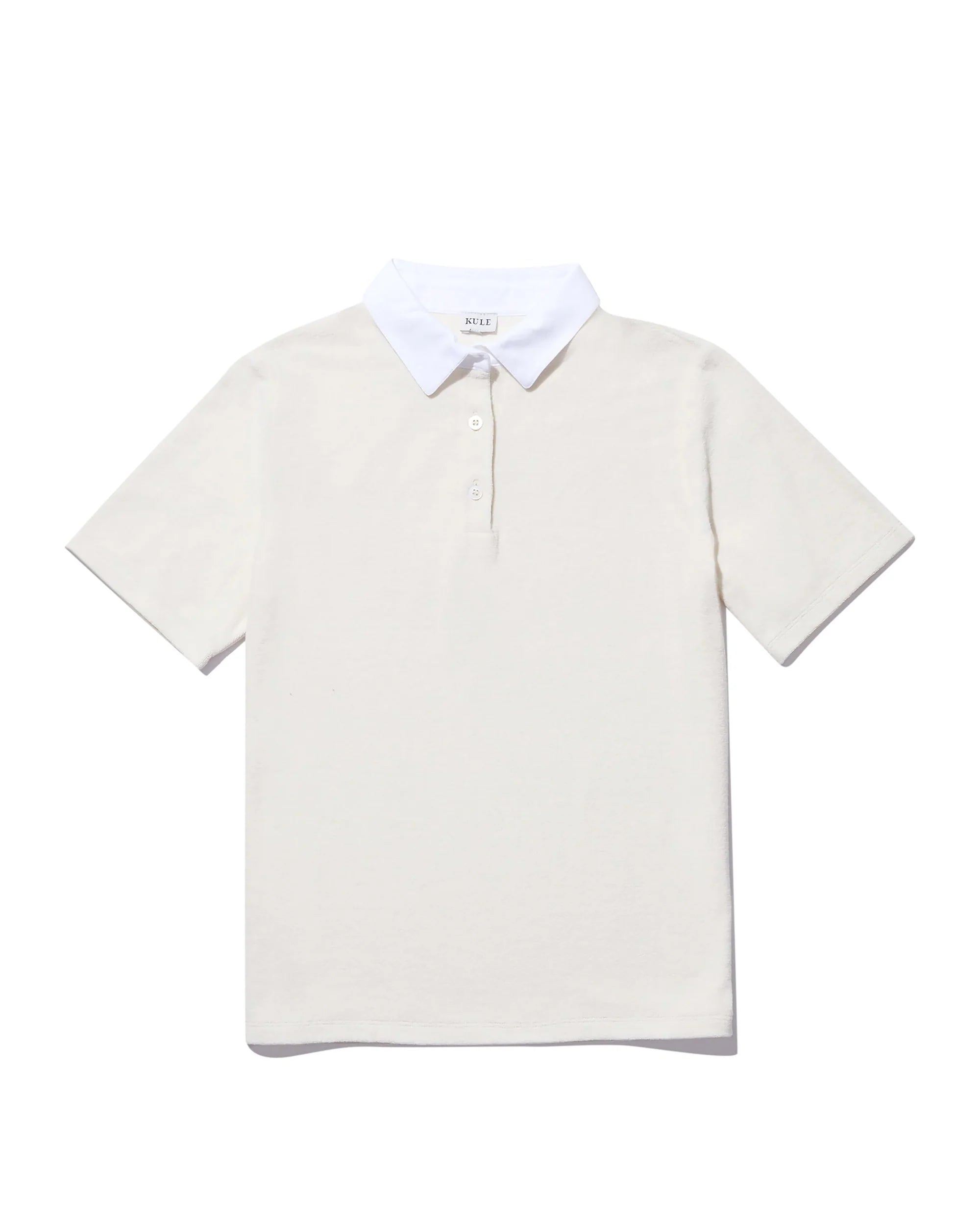 The Terry Polo by Kule: an off-white cotton terry short-sleeve polo with a contrasting white collar and three-button placket, shown flat on a white background—ideal for sporty chic beachwear.