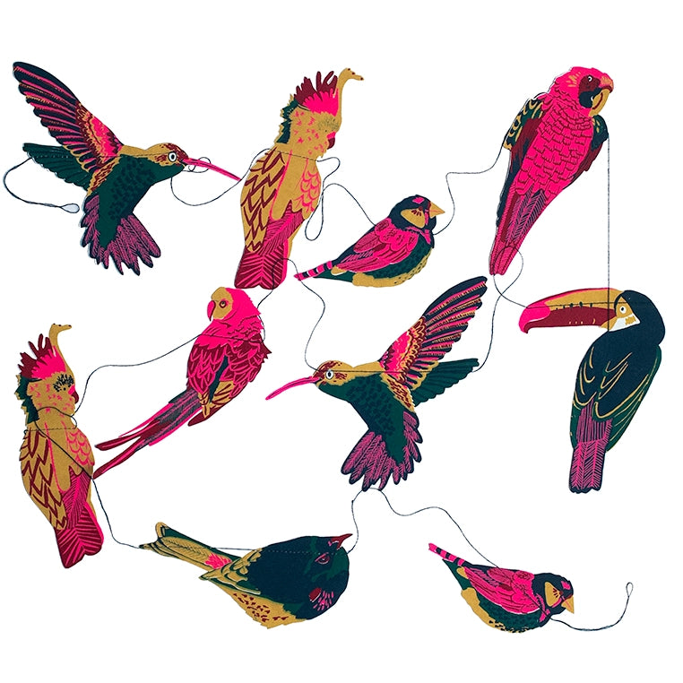 Faire’s Paper Garland/Chains features colorful illustrated tropical birds in pink, yellow, red, green, and black, all strung together for a festive birthday decoration.