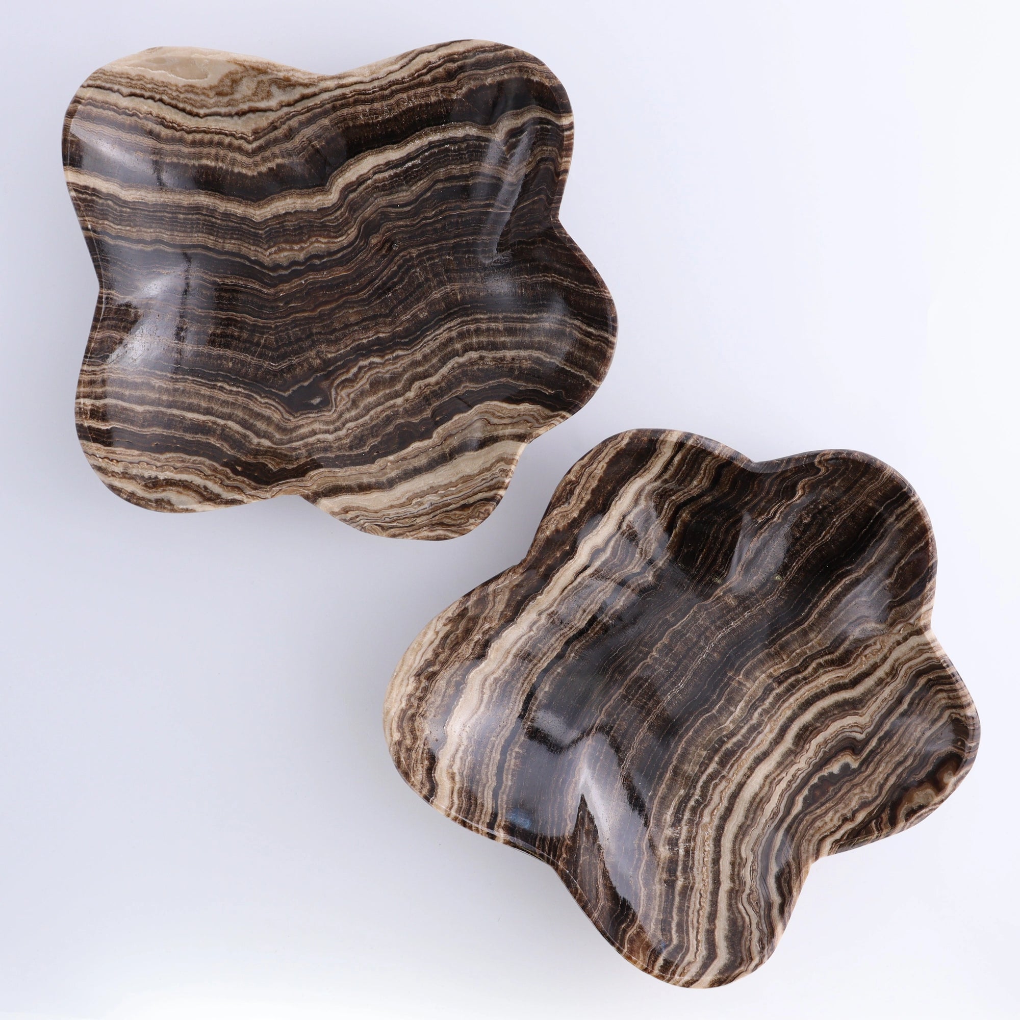 Mexican onyx bowls with brown and beige stripes by Faire, perfect for decorative accent or serving.