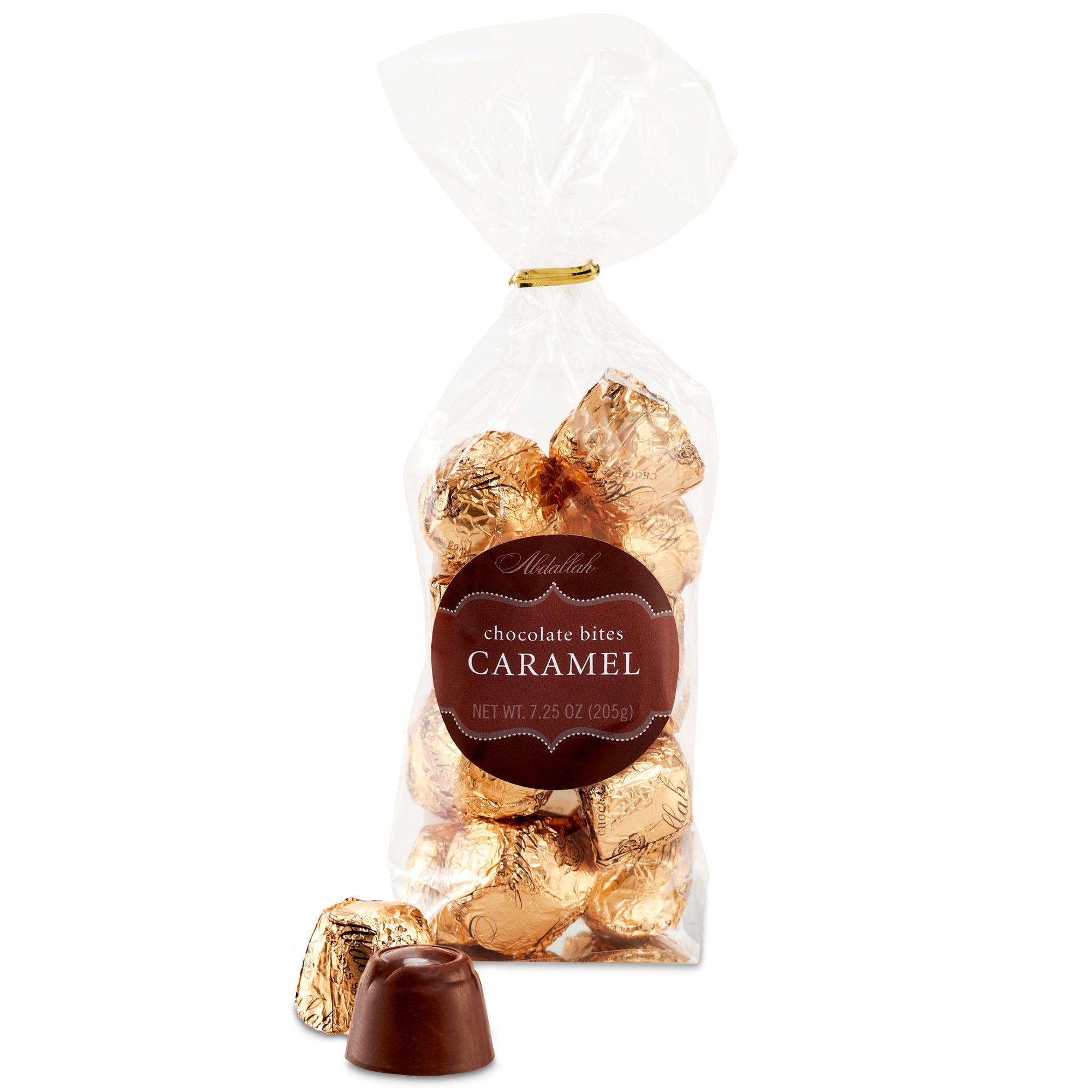 A white background showcases a clear bag labeled "Caramel Choco Bites 7.50z," featuring gold foil-wrapped smooth caramel milk chocolates from Abdallah. Two unwrapped bites are displayed in the front.