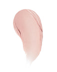 A shimmery light pink smear of Poppy & Pout Lip Tint in Farrah by Faire on a white background.