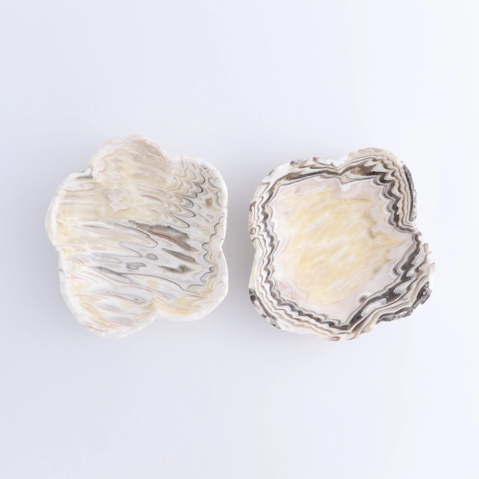 Pair of yellow and white marbled ceramic flower dishes inspired by Faire’s Mexican Onyx Zebra Bowl at Bungalow Furniture.