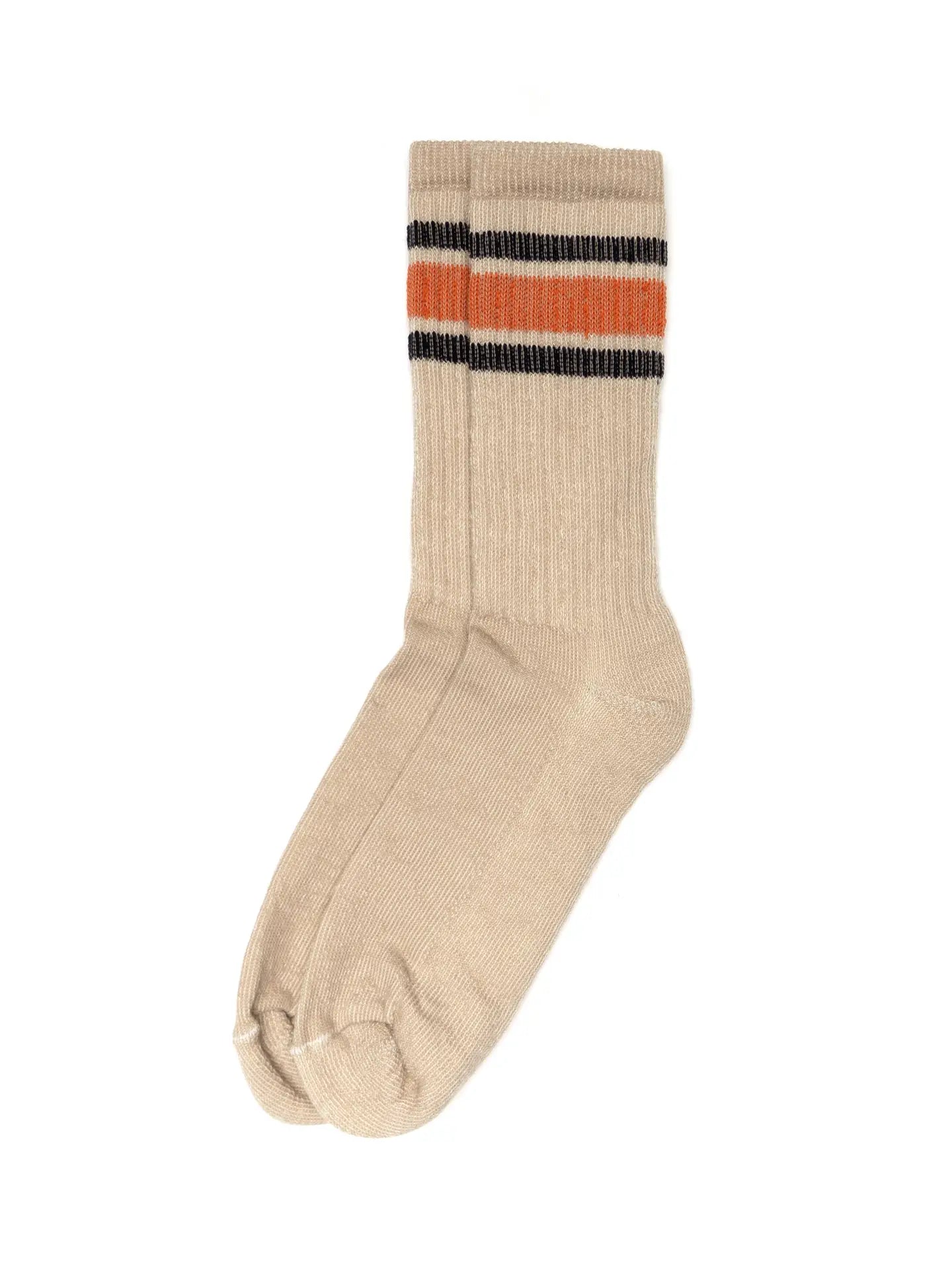 Faire Merino Socks: Beige crew-length socks with a ribbed texture and two horizontal stripes—one orange, one black—near the top. Laid flat on a white background. A stylish addition to your activity socks collection.