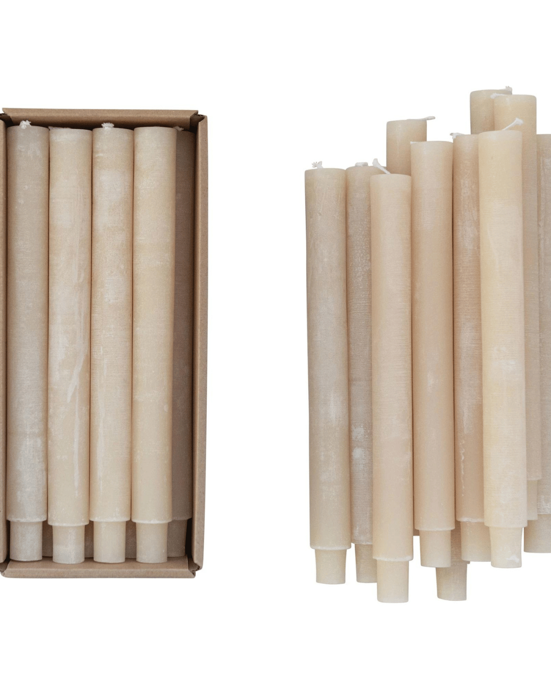 Image featuring a set of Creative Co-op Unscented Taper Candles S/12. On the left, nine candles are neatly arranged in a rectangular cardboard box. On the right, fourteen candles are stacked loosely in a bundle. Both groups of candles are identical in color and shape.